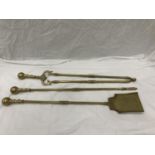 A BRASS COMPANION SET