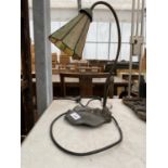 AN ART DECO STYLE TABLE LAMP WITH COLOURED GLASS SHADE