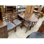 A REPRODUCTION GATELEG DINING TABLE AND FOUR LADDERBACK DINING CHAIRS