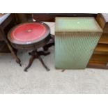 A LLOYD LOOM LINEN BASKET AND MINIATURE LIBRARY STYLE TABLE WITH INSET LEATHER TOP, 19" DIAMETER