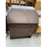 AN EARLY 20TH CENTURY OAK BUREAU, 29" WIDE