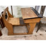 A MID 20TH CENTURY BEECH CHILDS DESK WITH INTEGRAL CHAIR