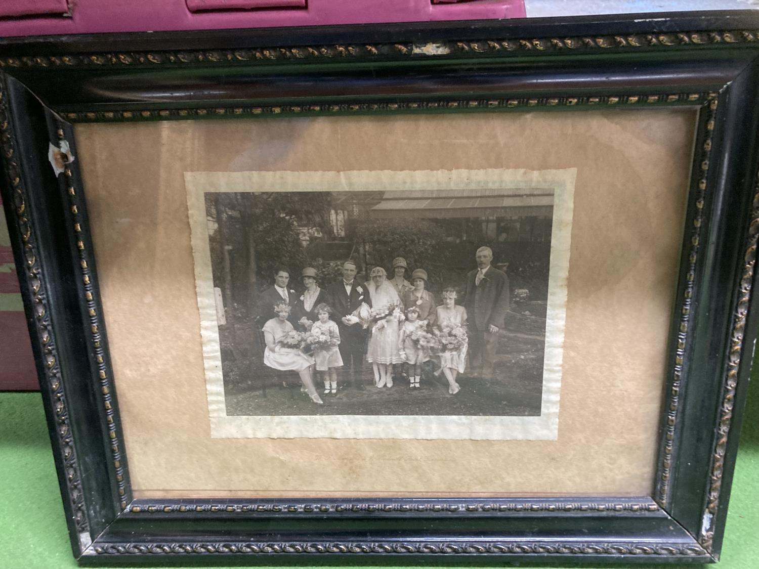 A FRAMED VINTAGE PHOTOGRAPH OF A WEDDING