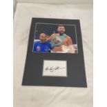 A MOUNTED PHOTOGRAPH OF WBC CHAMPION BOXER TONY BELLEW WITH TRAINER DAVE COLDWELL COMPLETE WITH