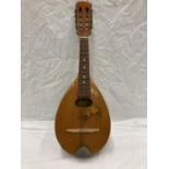 A WOODEN MANDOLIN