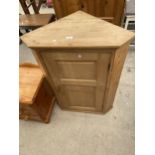 A VICTORIAN PINE SINGLE DOOR CORNER CUPBOARD COMPLETE WITH KEY, 29" WIDE