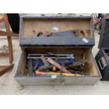 A VINTAGE WOODEN JOINERS CHEST WITH AN ASSORTMENT OF TOOLS TO INCLUDE SAWS, PLANES AND A BRACE DRILL