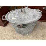 A LARGE GALVANISED LIDDED COOKING POT