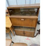 A MID 20TH CENTURY MINTY BUREAU BOOKCASE WITH TWO DOORS TO THE BASE AND FOUR SLIDING GLASS DOORS,