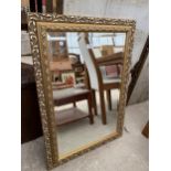 A MODERN GILT FRAMED WALL MIRROR, 36X25"