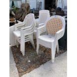 FOUR PLASTIC STACKING GARDEN CHAIRS