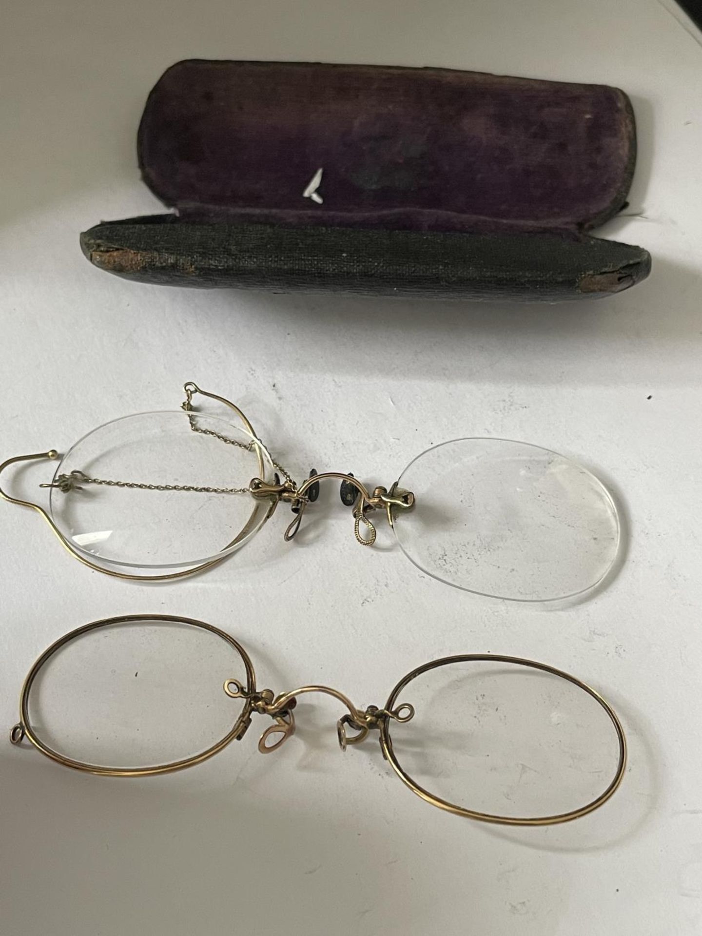 TWO PAIRS OF VINTAGE GOLD PLATED RIM PINCE NEZ IN A CASE
