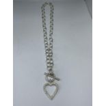 A MARKED SILVER T BAR NECKLACE WITH A HEART PENDANT