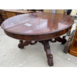 A VICTORIAN MAHOGANY PULL-OUT DINING TABLE ON QUATREFOIL BASE DECORATED WITH GRAPES AND LEAVES (NO