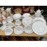 AN ASSORTMENT OF WHITE CERAMIC ITEMS TO INCLUDE TRIOS, PLATES AND TEAPOT ETC