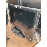 A TECHNIKA 26" TELEVISION WITH REMOTE CONTROL