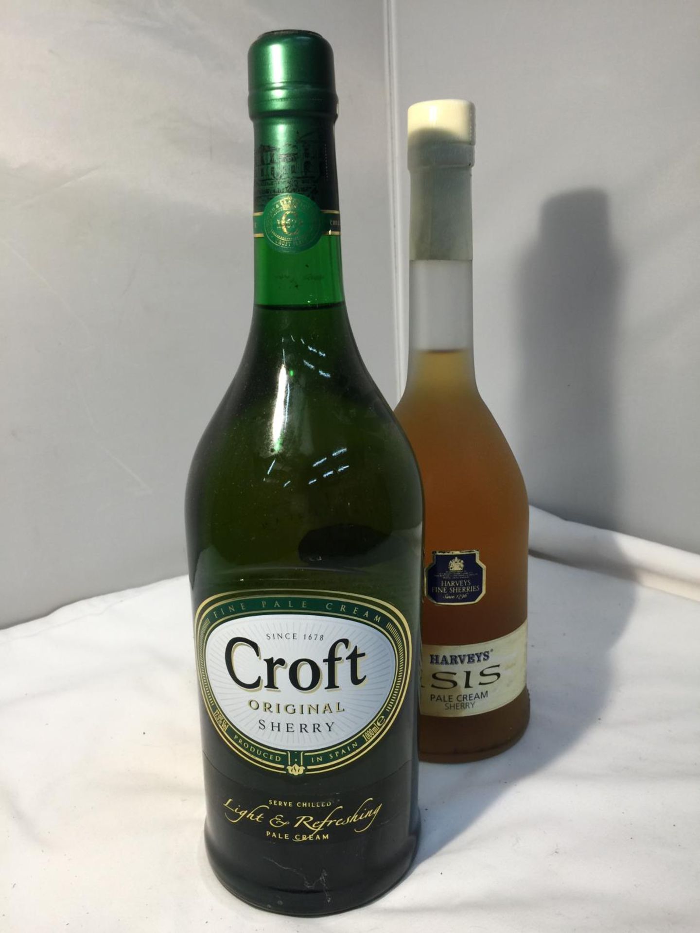 A 75CL BOTTLE OF HARVEYS ISIS PALE CREAM SHERRY 17.5% VOL AND A SECOND 1L BOTTLE OF CROFT ORIGINAL