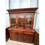 A VICTORIAN THREE DOOR GLAZED BOOKCASE ON BASE, ENCLOSING THREE DRAWERS AND THREE CUPBOARDS, 69"