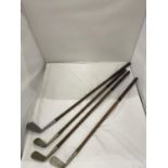 FOUR VINTAGE GOLF CLUBS WITH HICKORY SHAFTS, THREE 'SHELL' AND ONE 'THORNTONS'