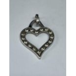 A 9 CARAT WHITE GOLD HEART SHAPED PENDANT