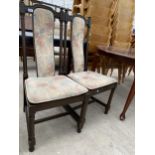 A PAIR OF ERCOL DINING CHAIRS ON TURNED LEGS AND UPRIGHTS