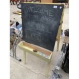 A VINTAGE A FRAME WITH A BLACKBOARD ONE SIDE AND A PAINTING SURFACE WITH SIX PAINT POT HOLDERS