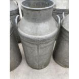 A VINTAGE MILK CHURN