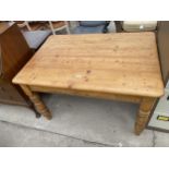 A VICTORIAN PINE KITCHEN TABLE ON TURNED LEGS, 48X33"