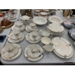 A PALISSY ART DECO TEASET TO INCLUDE TEAPOT, JUGS, SUGAR BOWL, CUPS, SAUCERS, PLATES, SERVING