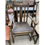 AN EARLY 20TH CENTURY OAK CARVER CHAIR WITH BARLEYTWIST FRONT LEGS AND UPRIGHTS