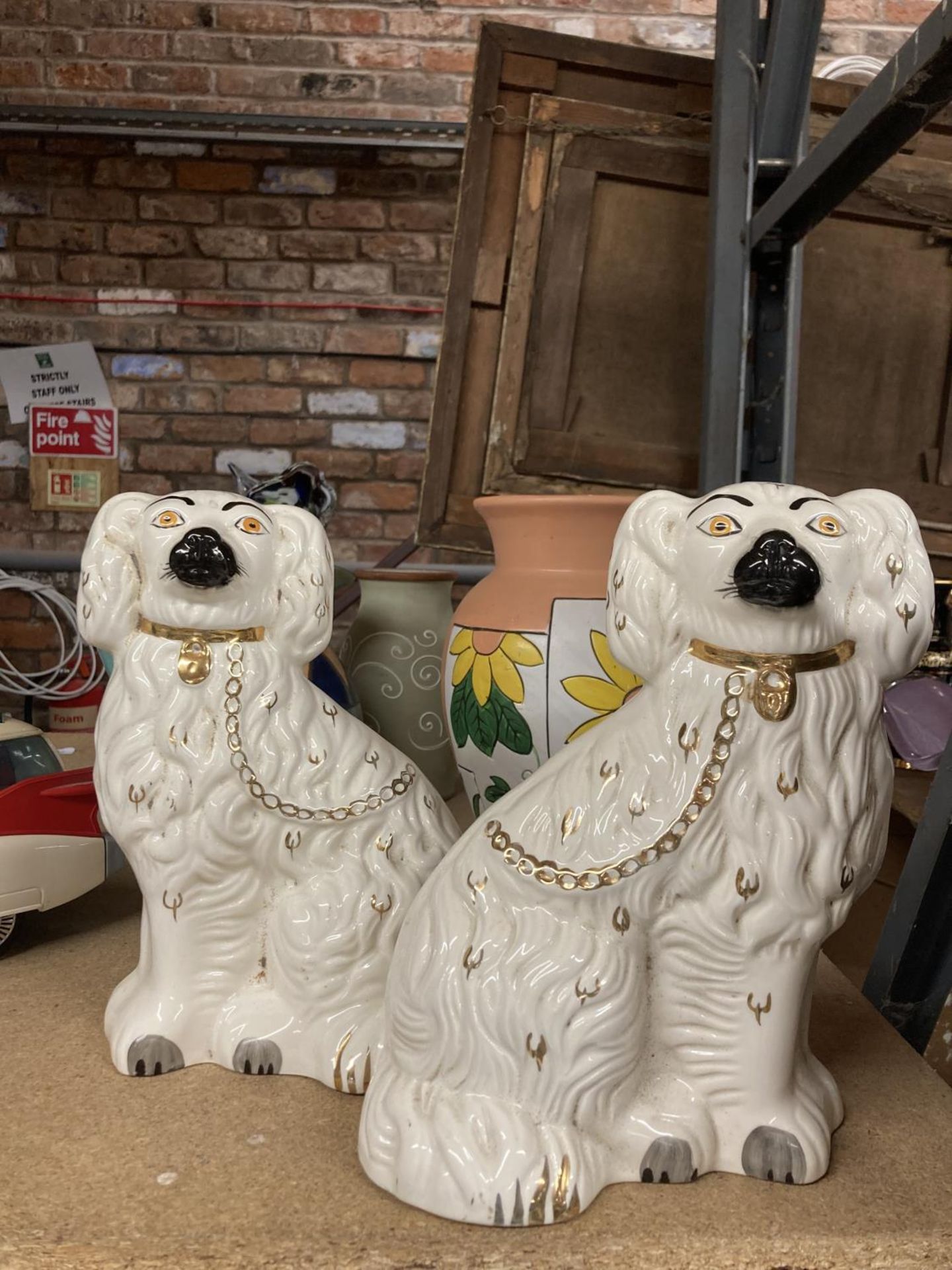 A PAIR OF STAFFORDSHIRE MANTLE DOGS