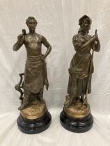 TWO SPELTER FIGURES THE BLACKSMITH AND THE HAYMAKER SIGNED C B PERRON PARIS WITH COIN REAR STAMP FOR