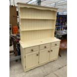 A MODERN PAINTED PINE DRESSER WITH PLATE RACK, 53" WIDE
