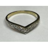 A 9 CARAT GOLD RING WITH DIAMONDS IN A WISHBONE DESIGN SIZE K