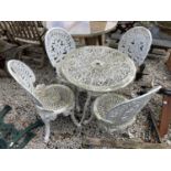 A WHITE CAST ALLOY BISTRO TABLE AND FOUR CHAIRS