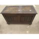 A REPRODUCTION OAK BLANKET CHEST WITH LINENFOLD FRONT PANELS, 36" WIDE