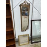 A 19TH CENTURY GILT FRAMED WALL MIRROR DECORATED WITH LEAVES AND RAMS HEADS, 50X18" COMPLETE WITH