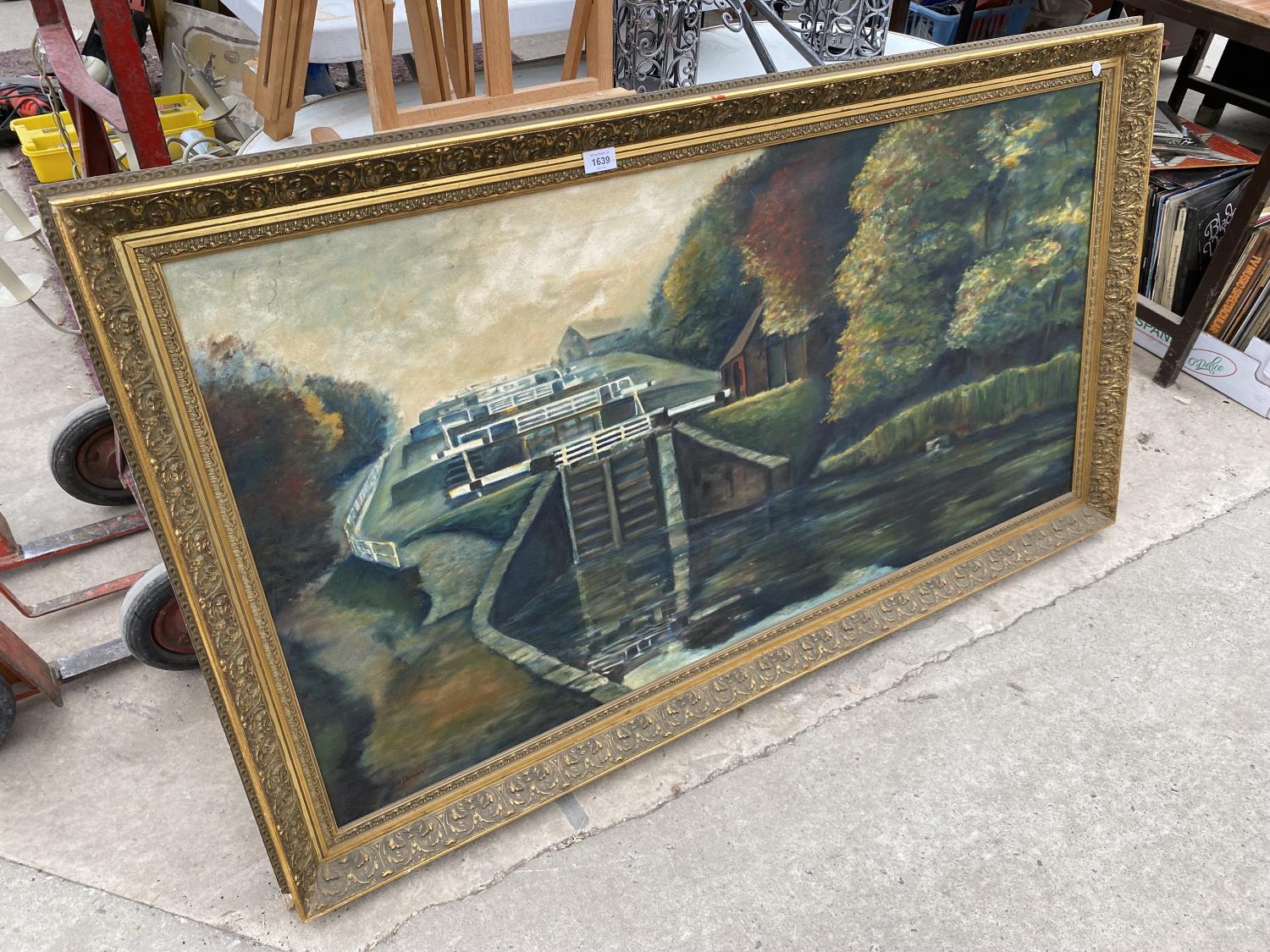 A LARGE GILT FRAMED OIL ON CANVAS OF CANAL LOCK SYSTEM