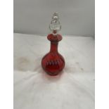 A CRANBERRY AND ENAMEL GLASS DECANTER WITH FLOWER DECORATION HEIGHT 26CM