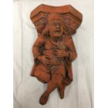 A TERRACOTTA WALL HANGING MINSTREL HEIGHT 56CM