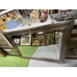 A LARGE MIRROR WITH PEWTER STYLE FRAME W: 105CM