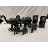 A FAMILY OF CARVED HARD WOOD ELEPHANTS TO INCLUDE MUM, DAD AND THREE BABIES PLUS A PAIR OF