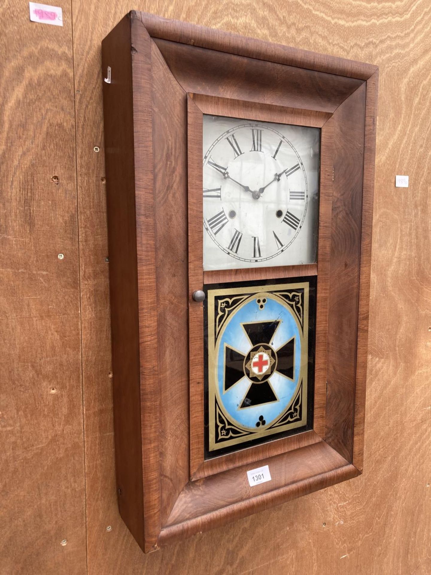 A THIRTY HOUR WALL CLOCK MANUFACTURED BY THE NEWHAVEN CLOCK CO