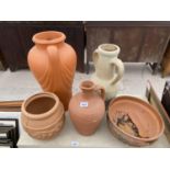 A TERRACOTTA PLANTER, A TERRACOTTA JUG AND TWO TERRACOTTA URNS