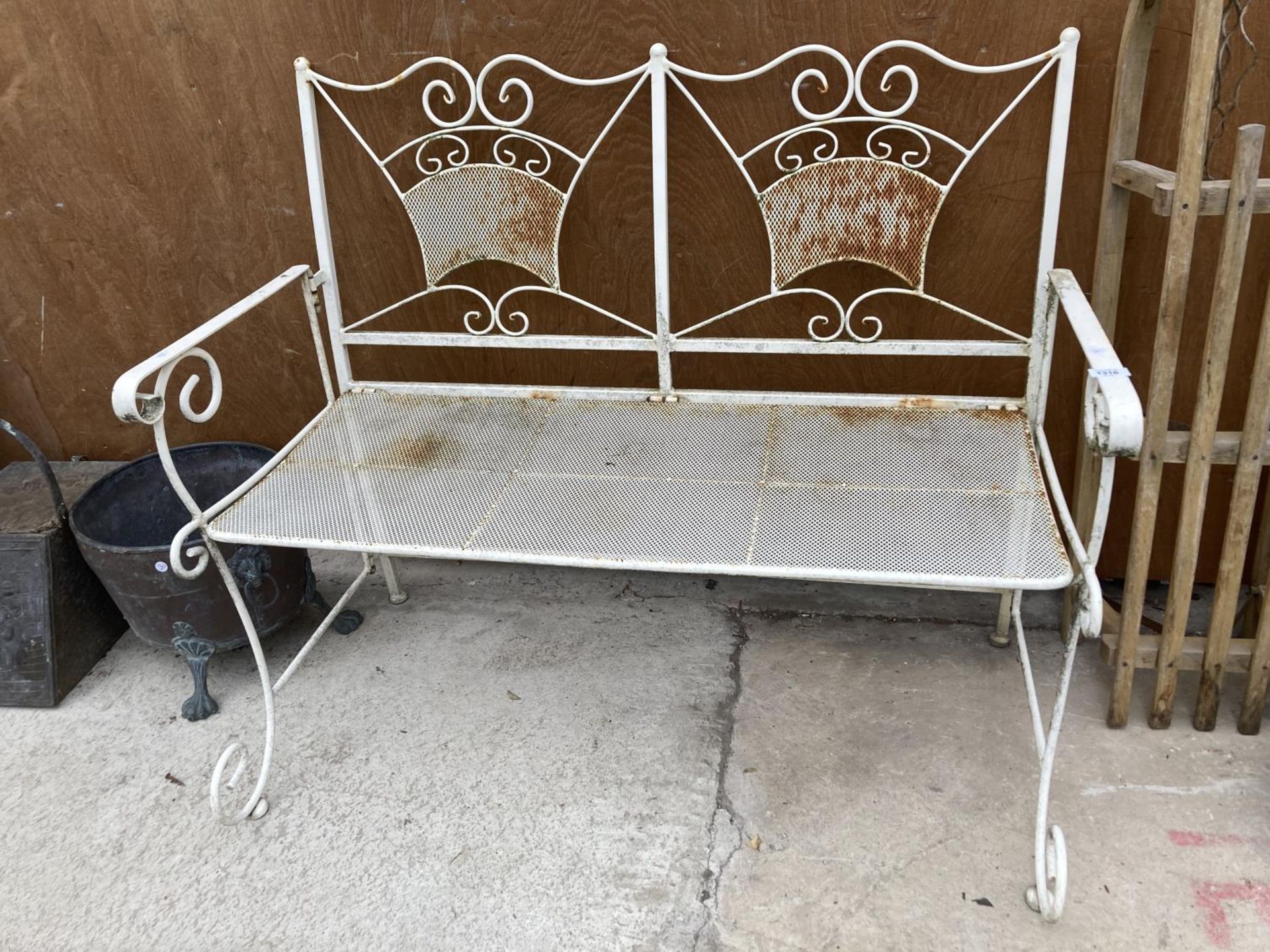 A WHITE METAL FOLDING BENCH SEAT