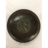 A BRONZE CHARGER WITH ORIENTAL DESIGN TO COMMEMORATE THE 25TH YEAR OF EMPLOYMENT OF RUDOLF FUNCKE AT