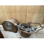 AN OAK CASED MANTLE CLOCK, VINTAGE TAPS AND A CAST PAN