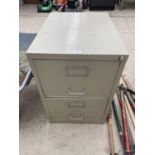 A TWO DRAWER METAL FILING CABINET