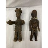 TWO HAND CARVED AFRICAN TRIBAL FIGURES, ONE BEING A FEMALE FERTILITY FIGURE. THE NAILS ARE TO