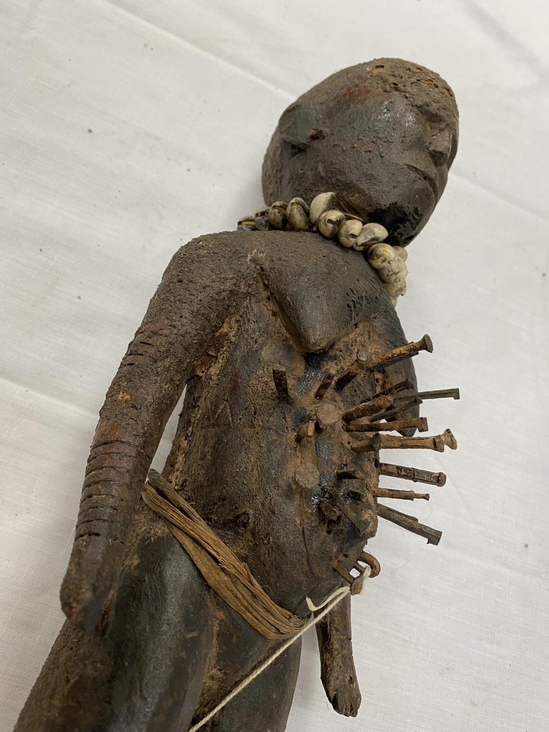 TWO HAND CARVED AFRICAN TRIBAL FIGURES, ONE BEING A FEMALE FERTILITY FIGURE. THE NAILS ARE TO - Image 15 of 16